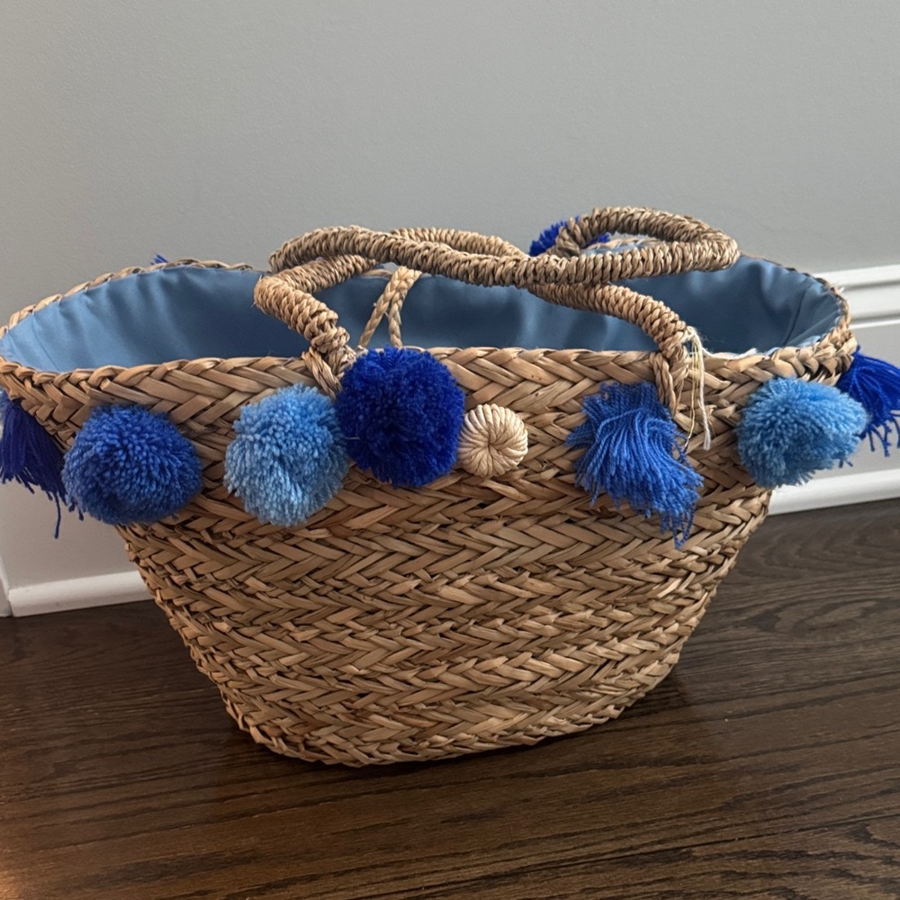 Woven Basket with Blue Pom Poms